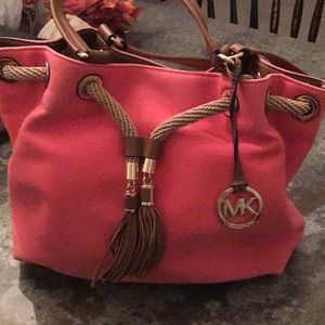 Michael Kors canvas and leather bucket bag in a poppy color
